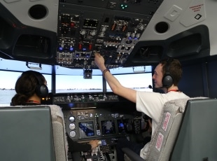 Engineering students in flight simulator