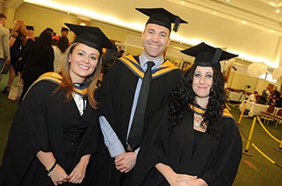 graduates posing for a picture