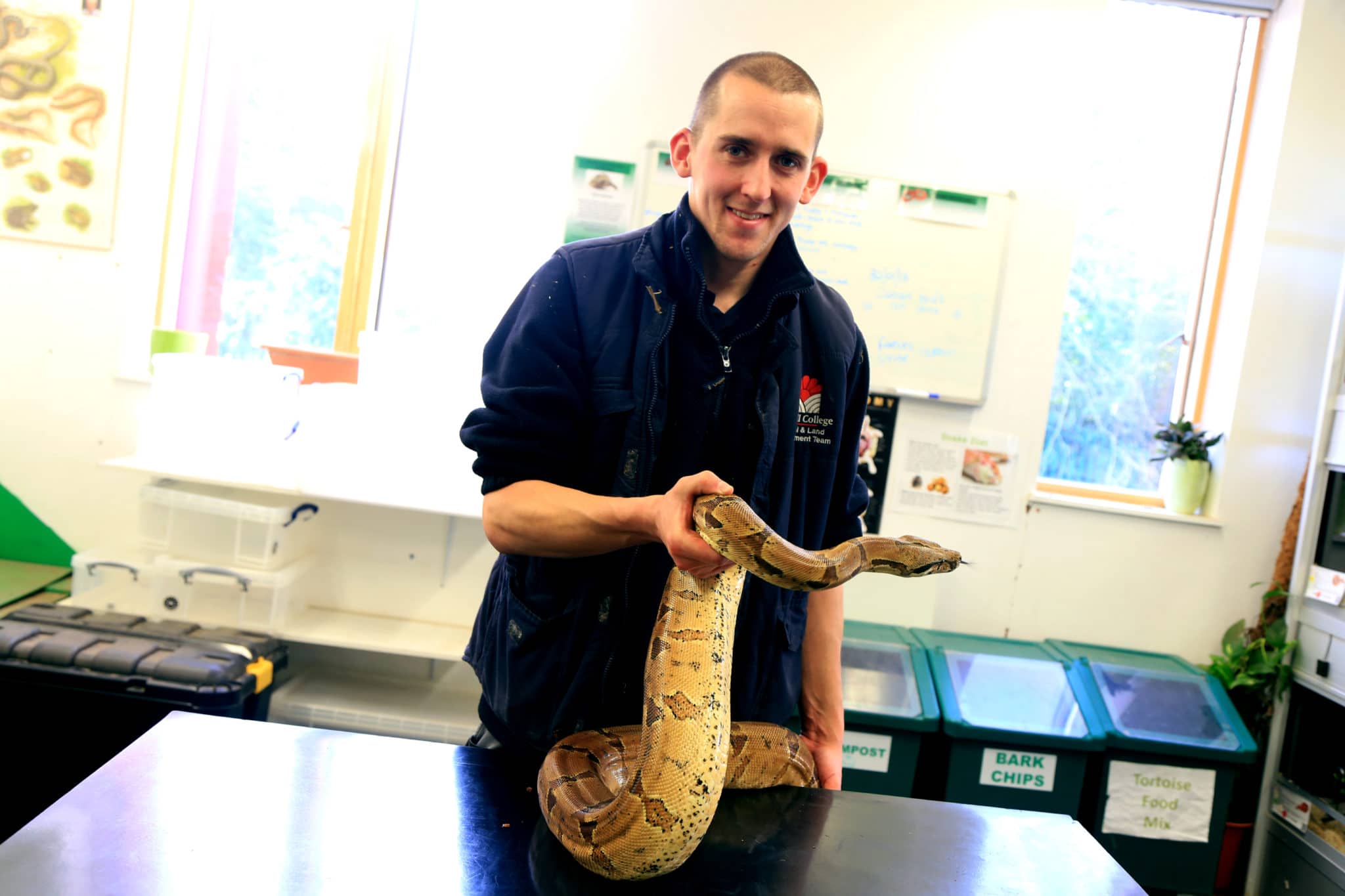 snake being held by students