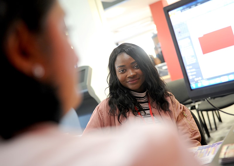 zoomed out image of student at advice day