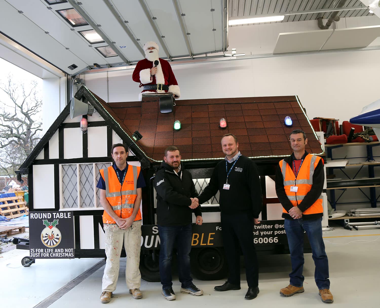 Staff at the College and the Round Table with the Santa House