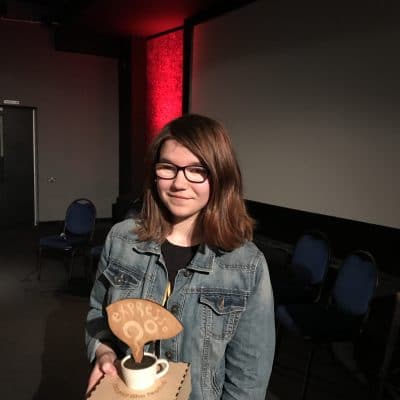 Jemma holding her award