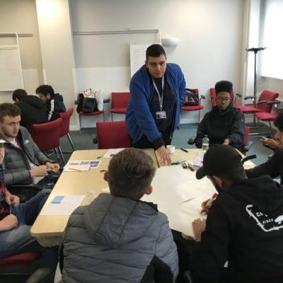 students at Hayley Ridewood visit sat around table