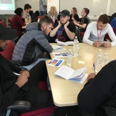 students at Hayley Ridewood visit sat around table