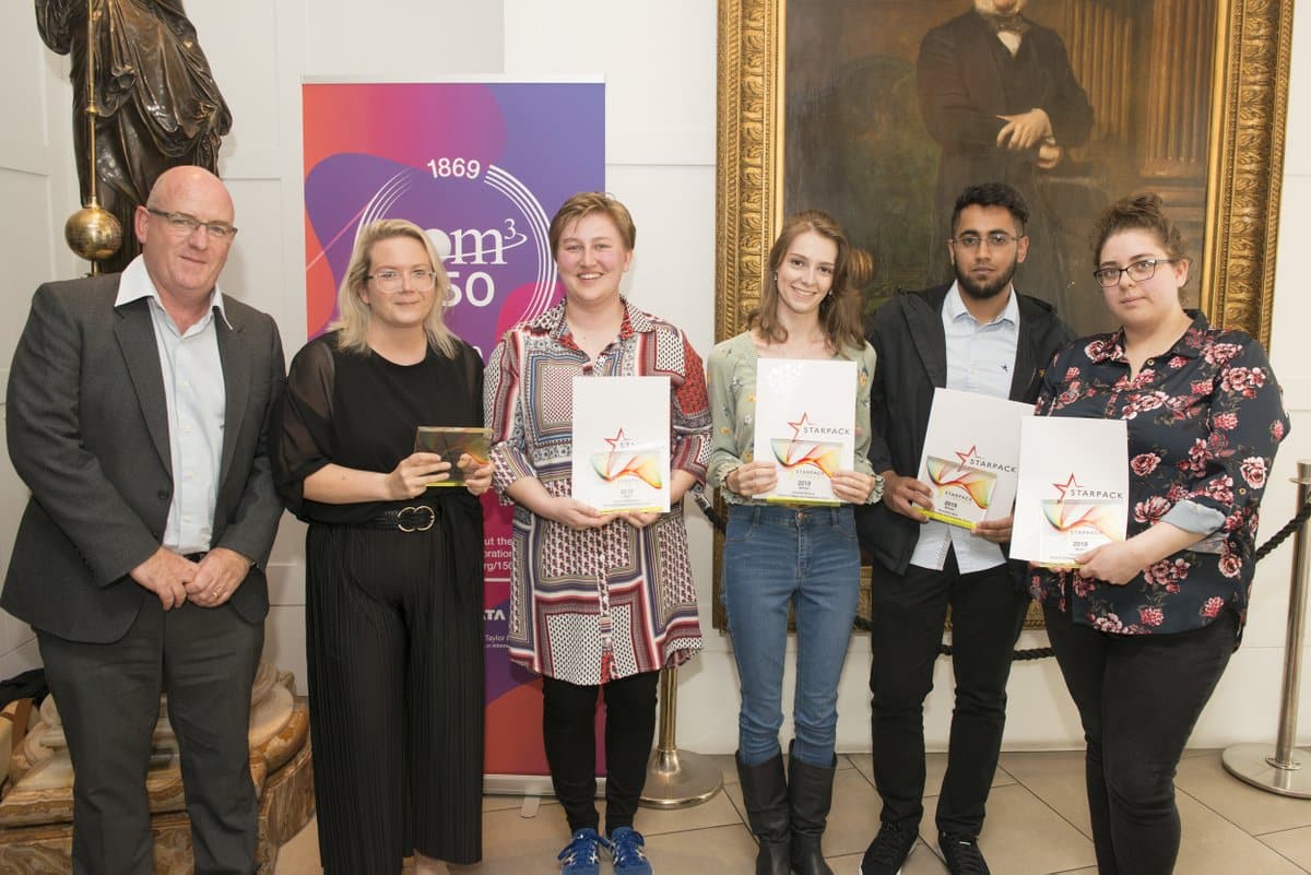 Tutor with students at award night