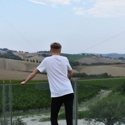 boy looking over fields