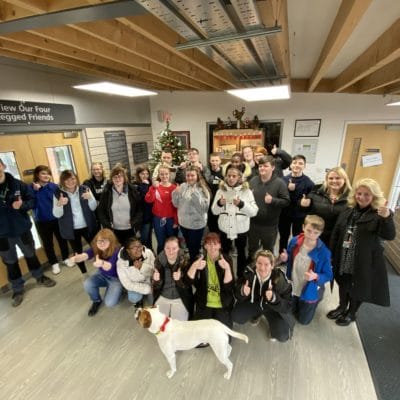 group picture with students putting their thumbs up
