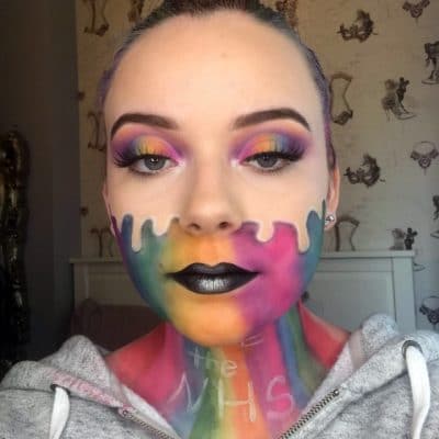 Liliana Smith with rainbow makeup and the words thank you NHS on her neck.