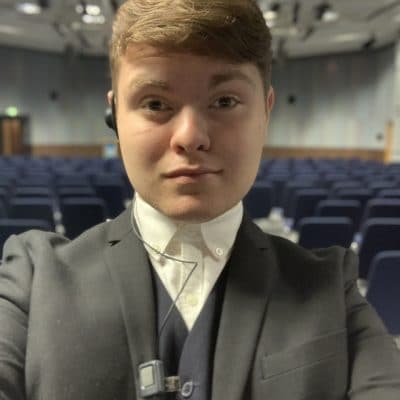 Joshua Charnley at the event in a suit