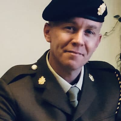 Dan Derby dressed in his military wear and beret.