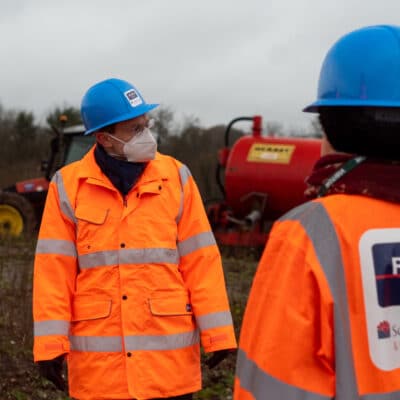 Mayor Andy Street in PPE looks around the site