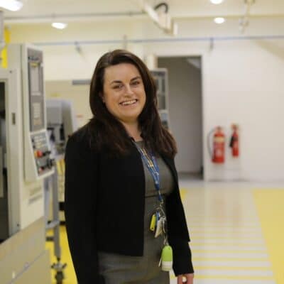 Rosa Wells stands in a workshop