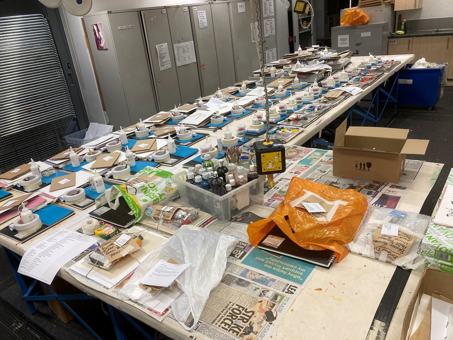 Art supplies laid out on a desk for packs.