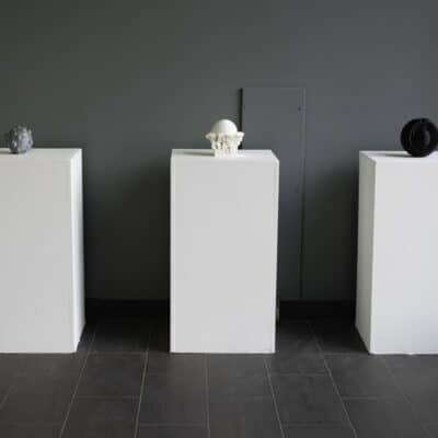 three stands with clay work on it