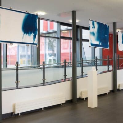 portraits hanging up in the foyer