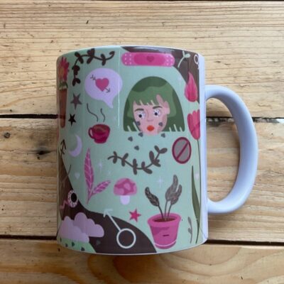 Eliza's mug design featuring a womans face and some flowers.