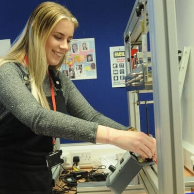 A female student at work in the robotics lab