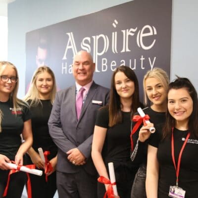 John with hair and beauty students