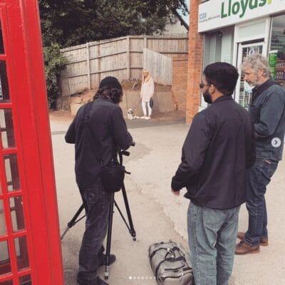 Students taking photo of a dog walker at solihull college