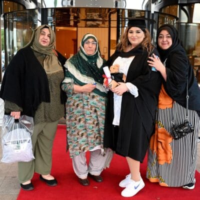 Student celebrates with her family