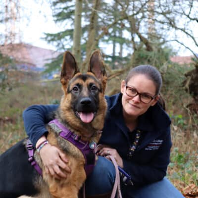 woman with arm around dog