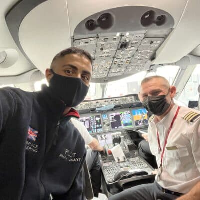 student in flight deck with pilot
