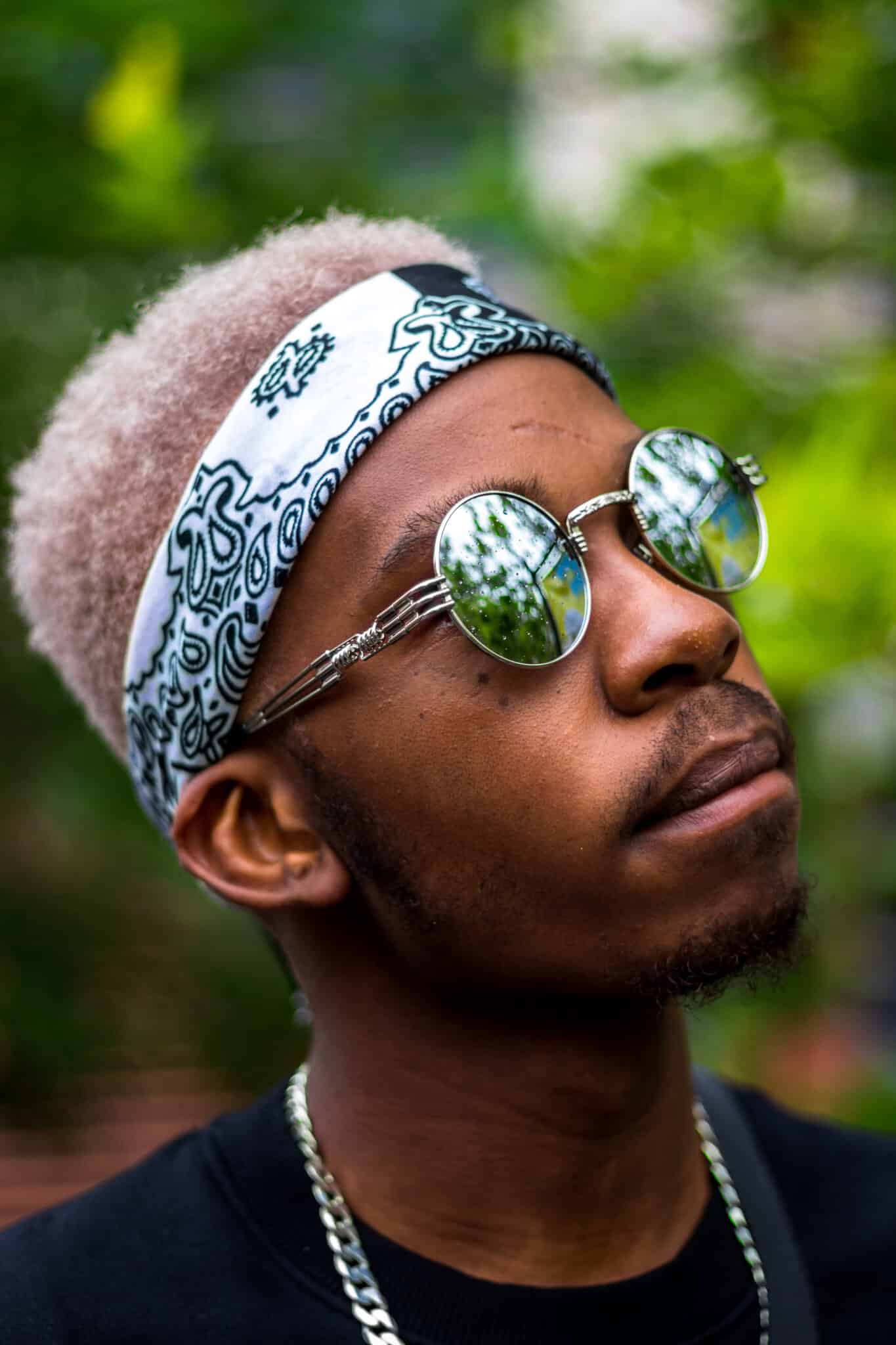 Man looking up with sunglasses and headband on