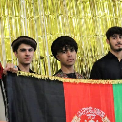 Students holding flag