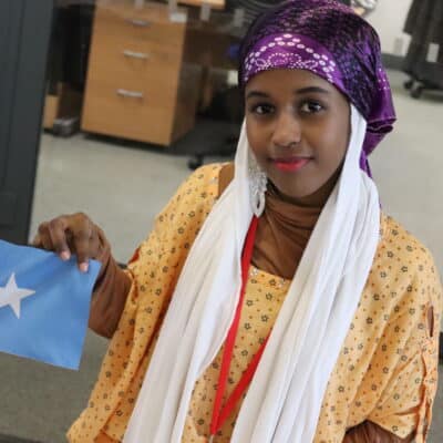 Student holding flag