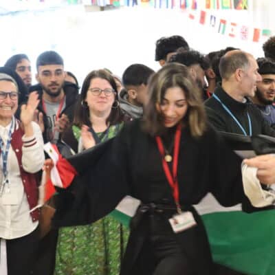 Student dancing with flag