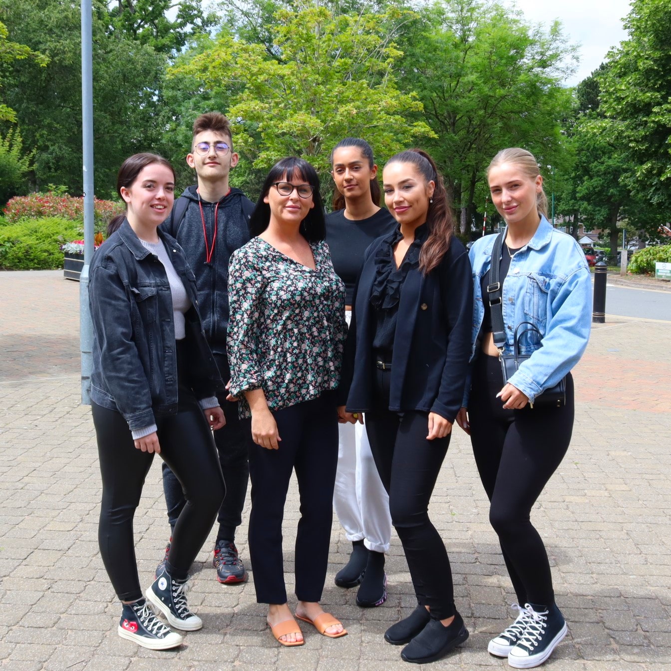 6 students standing next to each other