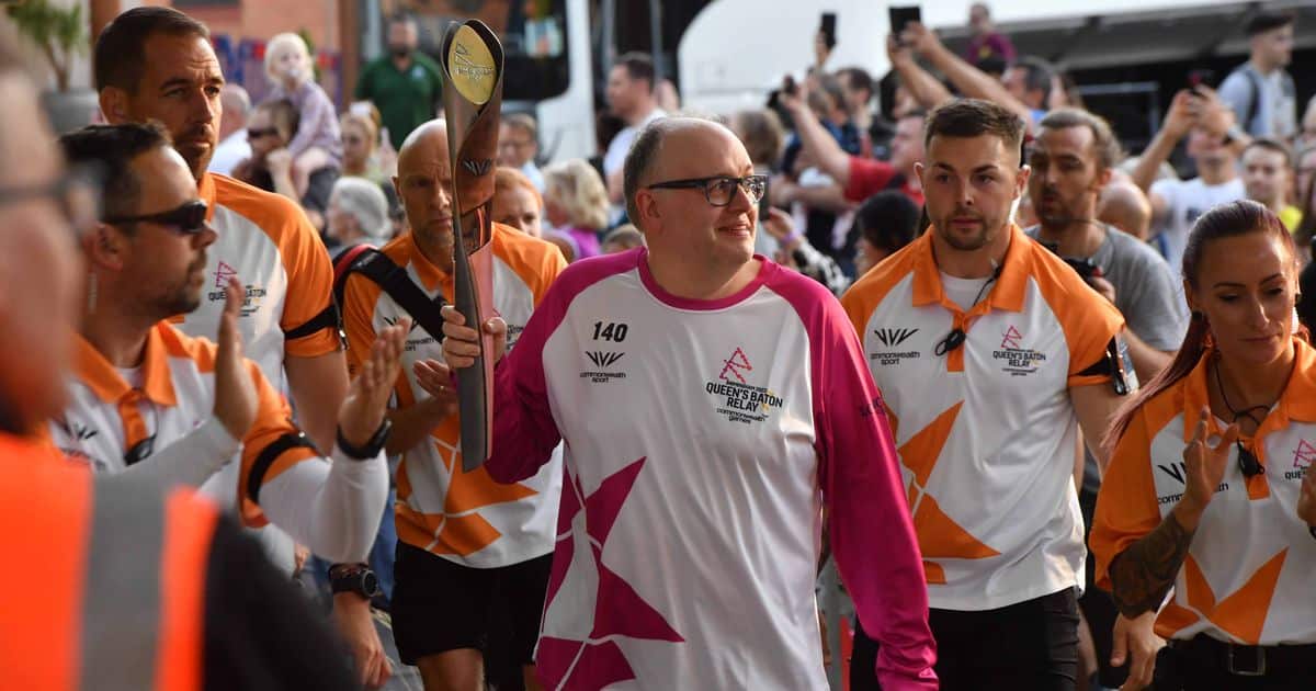 Andrew carrying the baton
