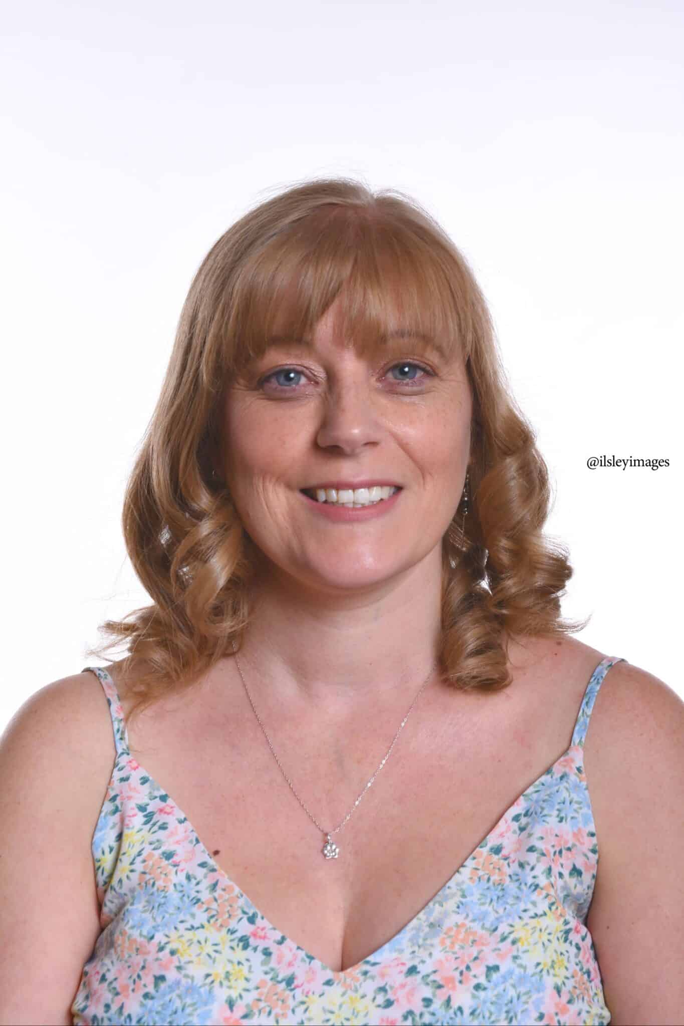 Wedding guest face on in blue floral strappy top