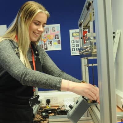 Student using engineering equipment
