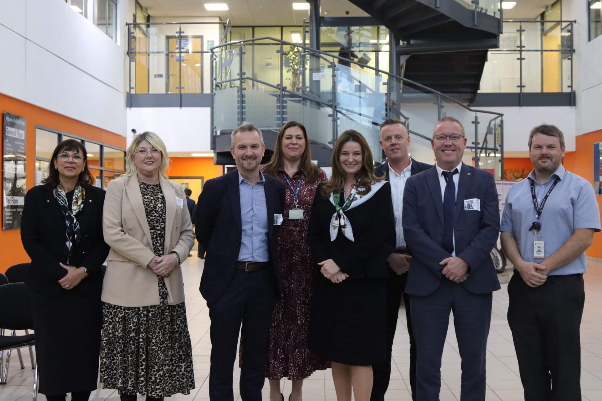 Employers standing in atrium with Gillian Keegan