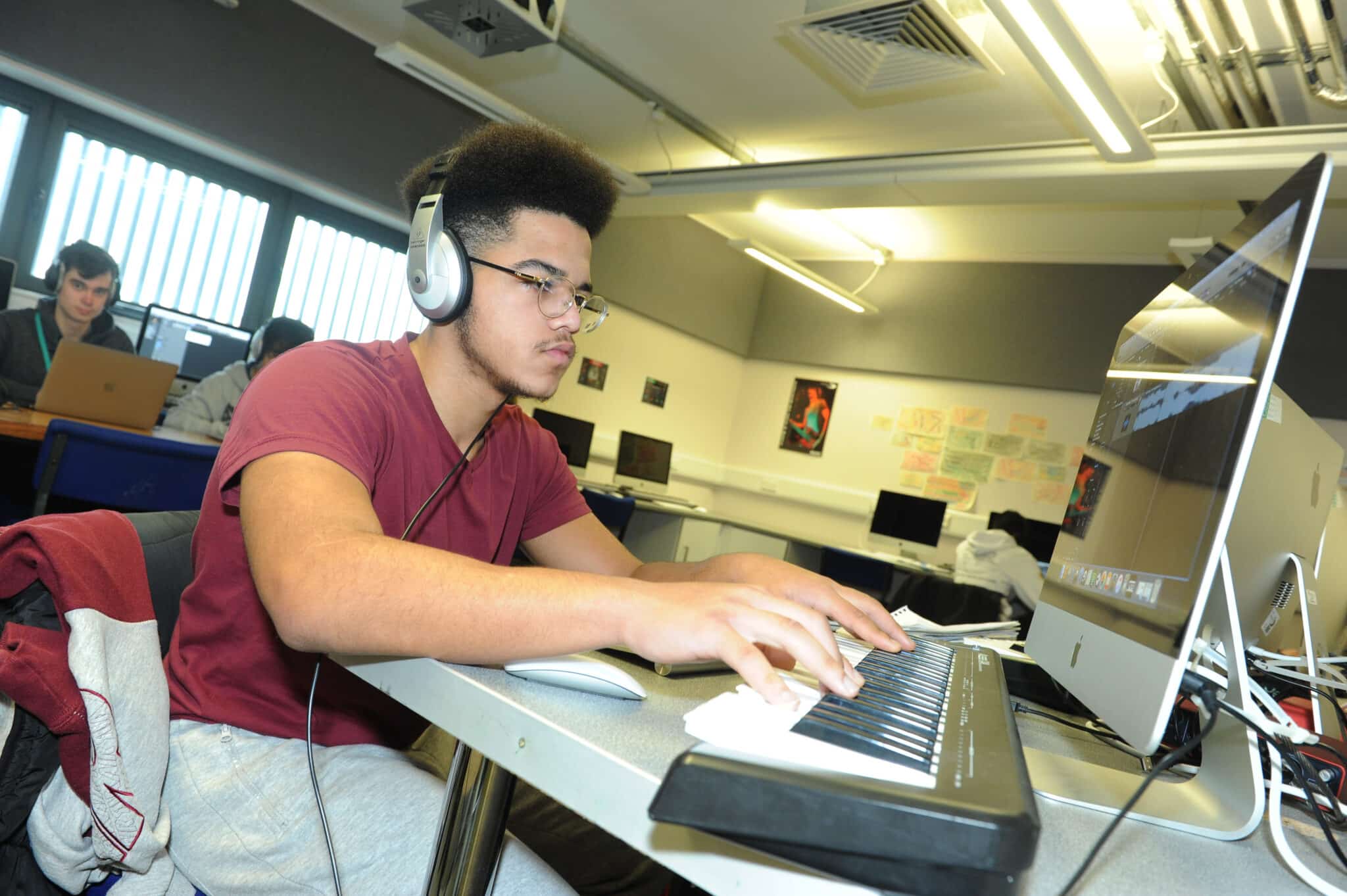 Student producing music on a Mac