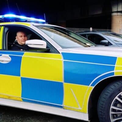 Lecturer in police car