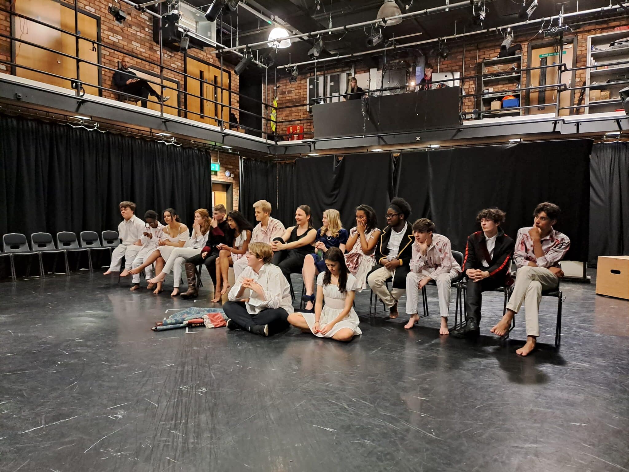 Performing arts students sitting