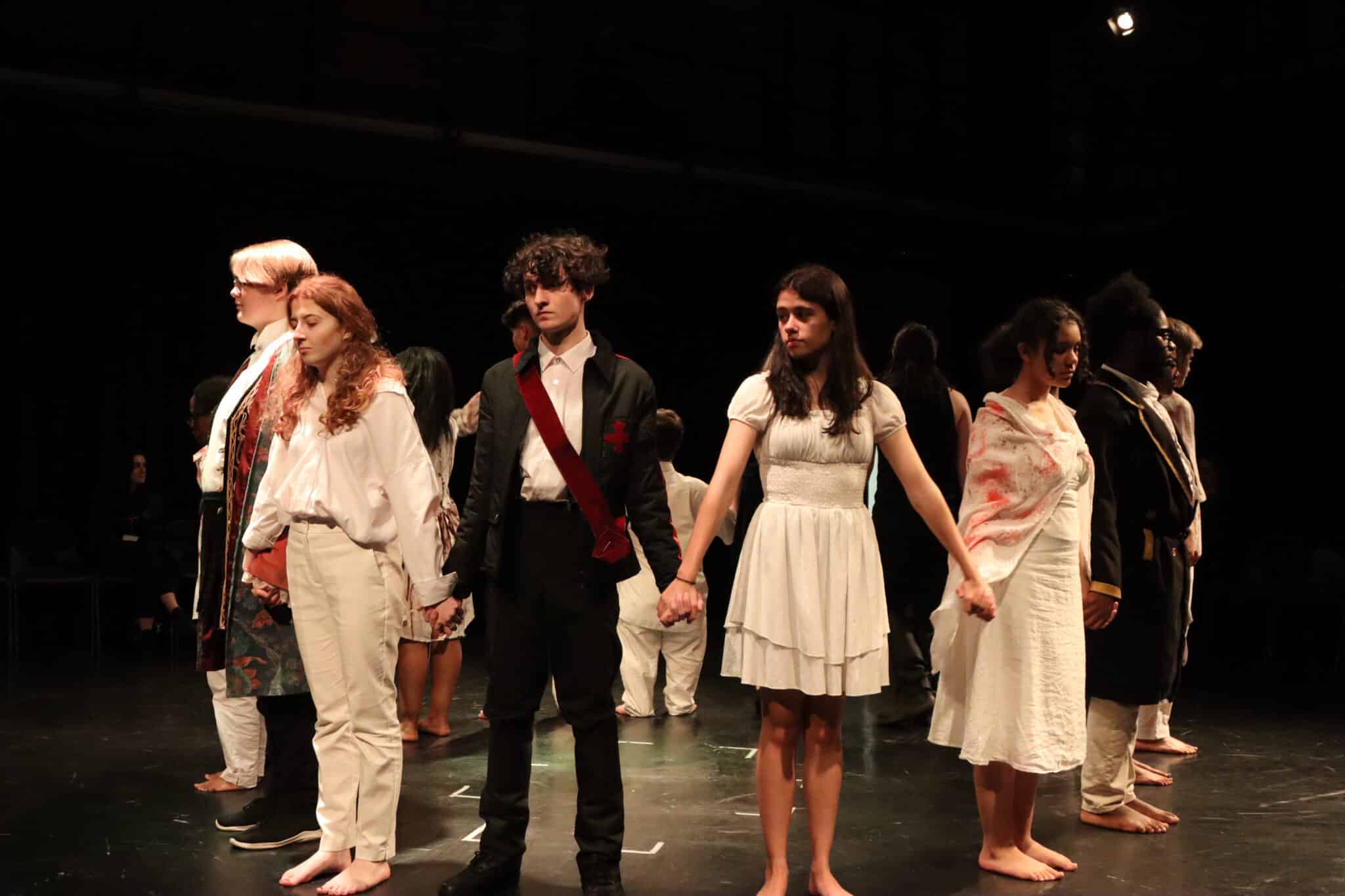 Performers bowing at end of play