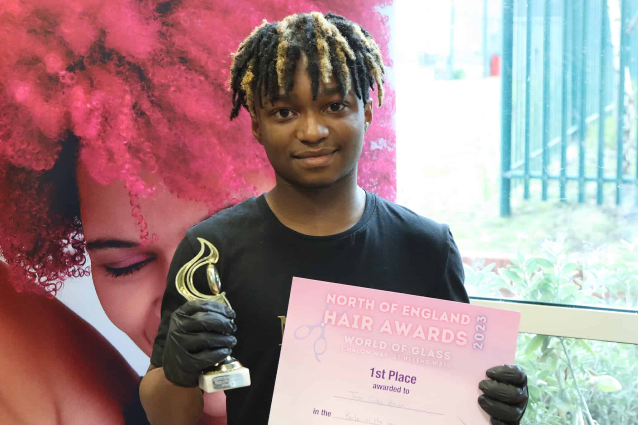 Barbering students win big - 1st place held by young man