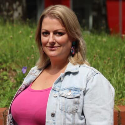 Maggiie standing outside the college