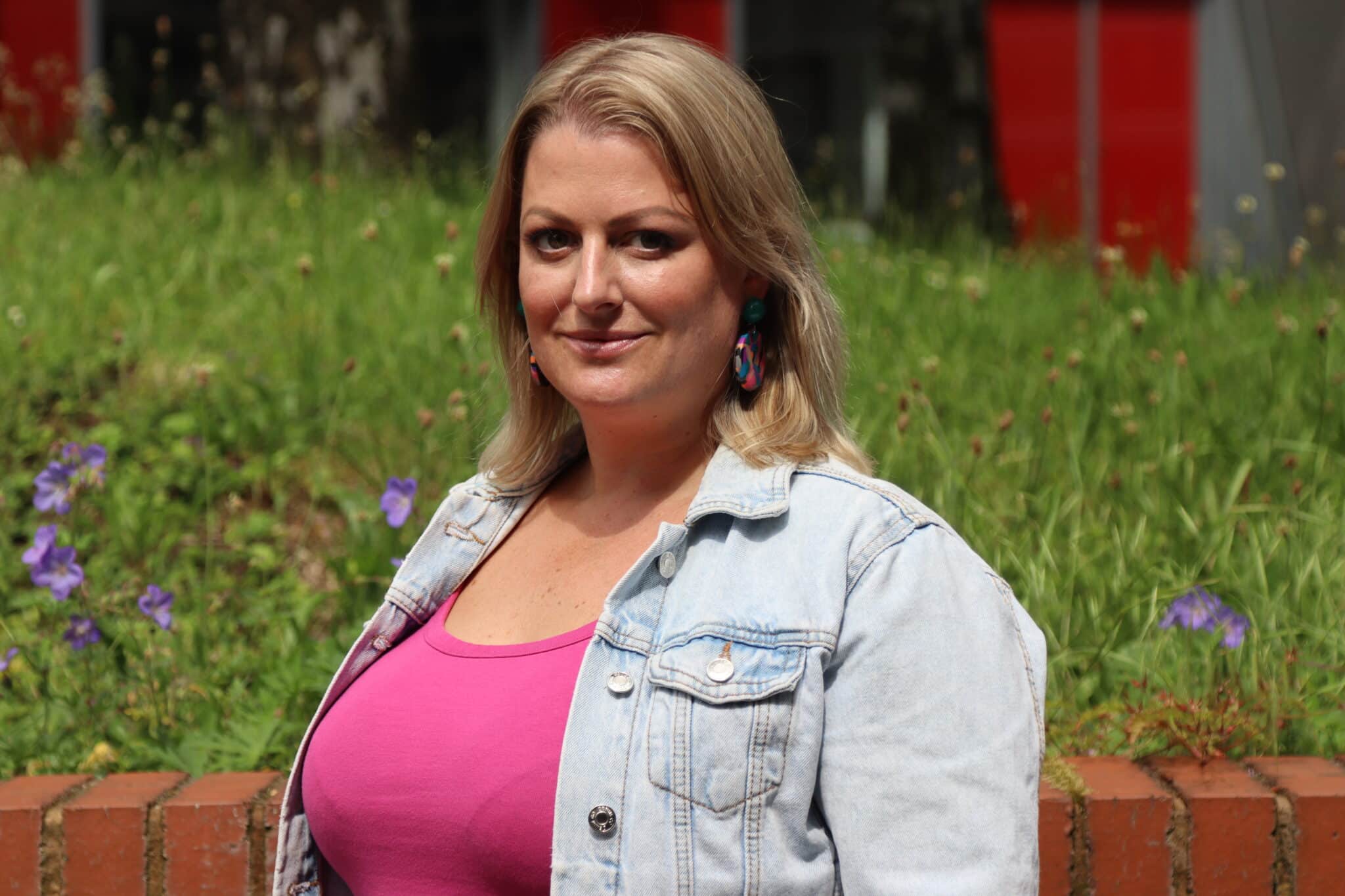 Maggiie standing outside the college