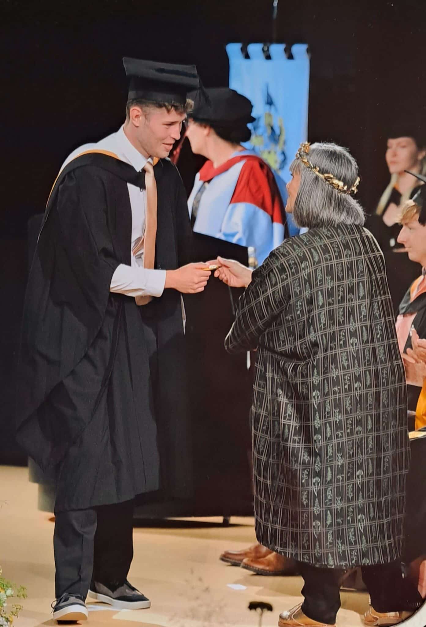 Callum at his graduation ceremony with Dawn French