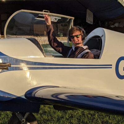 Former student Joe in the cockpit of a small plane