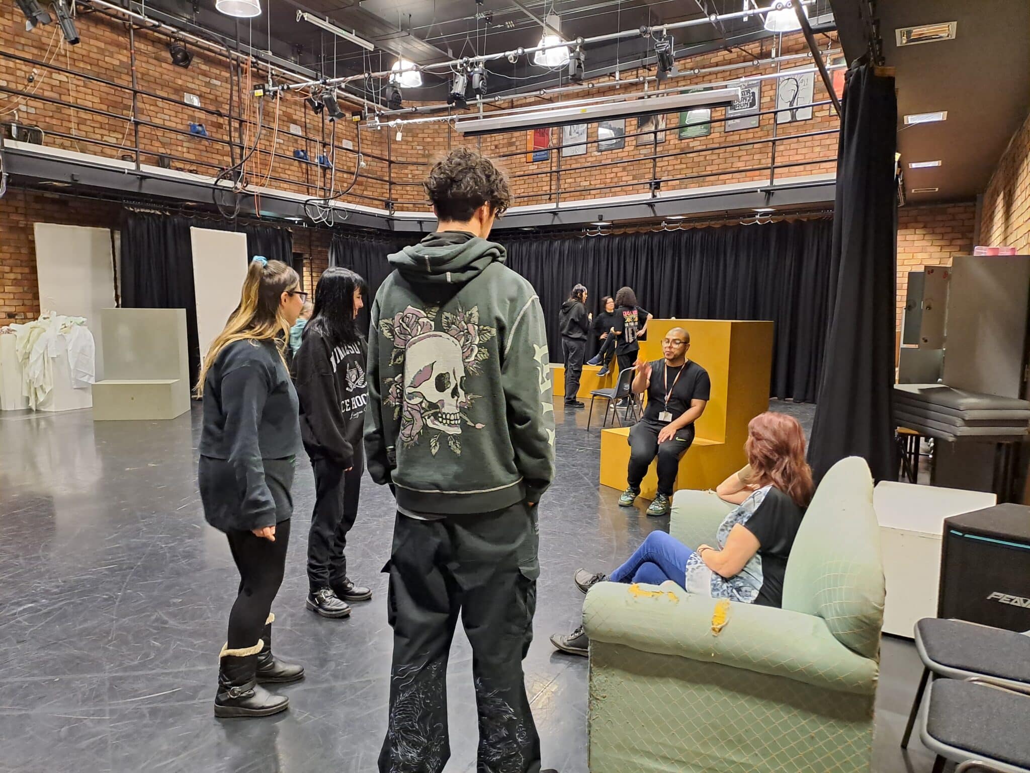 performing arts students teaching their teacher in the theatre