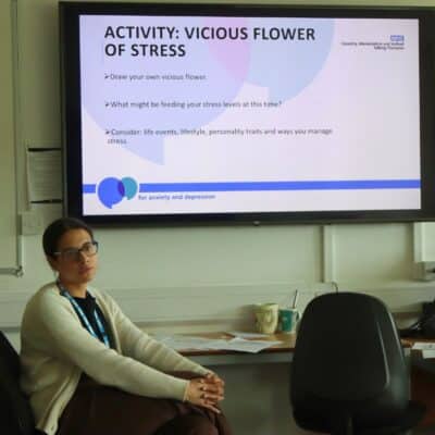 facilitator sat down in front of screen