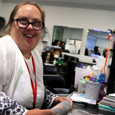 student looking at camera smiling