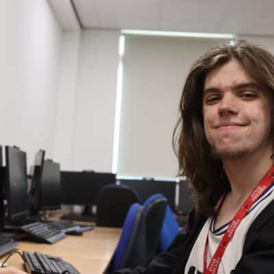 Patrick sat in front of computer