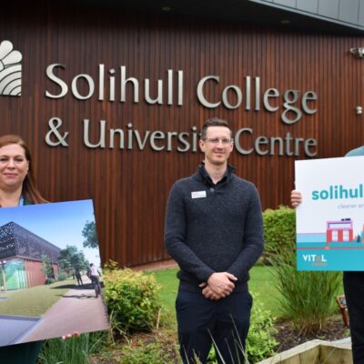 Principal Dr Rebecca Gater holding a sign about Solihull Energy outside the college