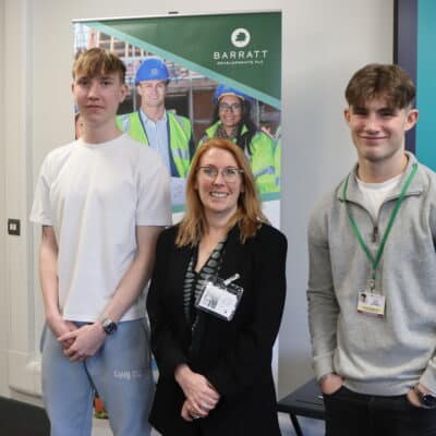 T-Level students standing with their placement employer